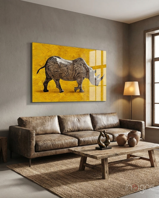 Saffron Rhino glass wall art displayed above a leather sofa in a charcoal-walled lounge