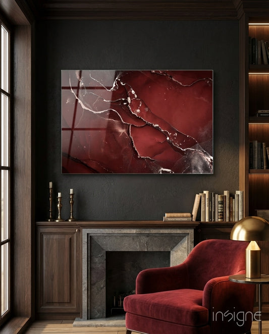 Crimson Marble glass wall art displayed above a velvet armchair in a wood-paneled study