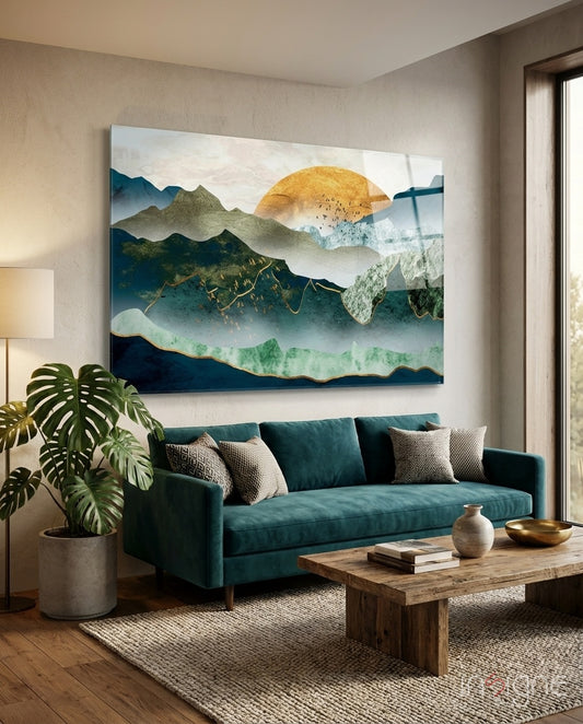 Golden Mountains glass wall art displayed above a teal velvet sofa in a serene living room