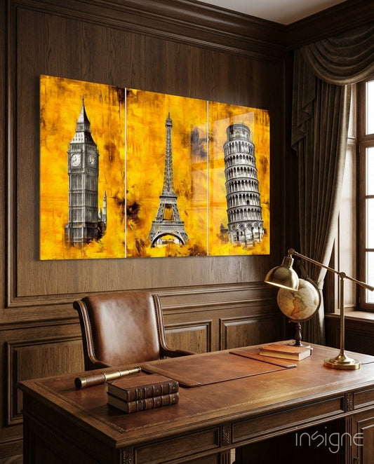 European Landmarks glass wall art displayed above a leather desk in a wood-paneled study