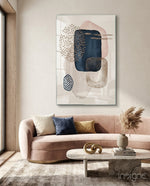 Boho Cluster glass wall art displayed above a blush velvet sofa in a sunlit minimal living room