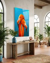 Twin Flamingos glass wall art displayed above a console in a Mediterranean foyer