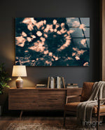 Coral Bloom glass wall art displayed above a wood console in a charcoal living room