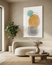 Sun And Moon glass wall art displayed above a curved boucle sofa in a beige sunlit lounge