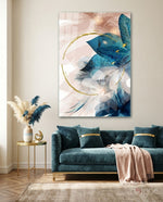 Coral Bloom glass wall art displayed above a teal velvet sofa in a contemporary lounge