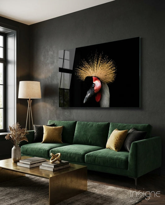 Crowned Crane glass wall art displayed above a green velvet sofa in a charcoal-walled lounge