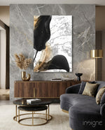 Marble Feathers glass wall art displayed above a wood sideboard in a marble-walled living room