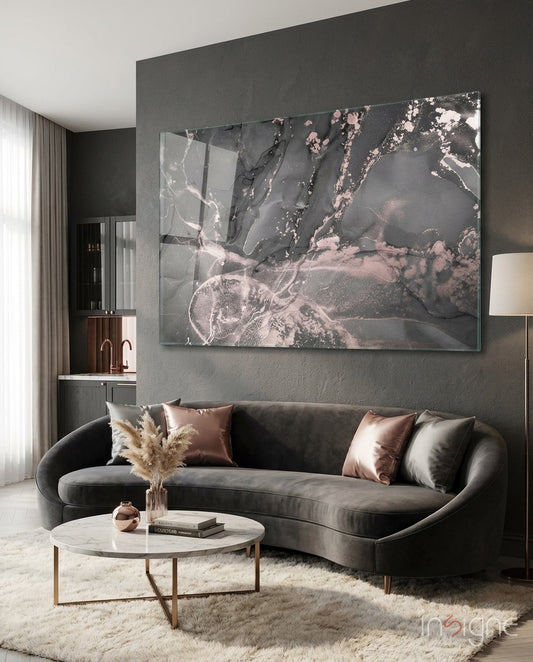 Smoke and Blush glass wall art displayed above a curved grey velvet sofa in a charcoal-walled lounge
