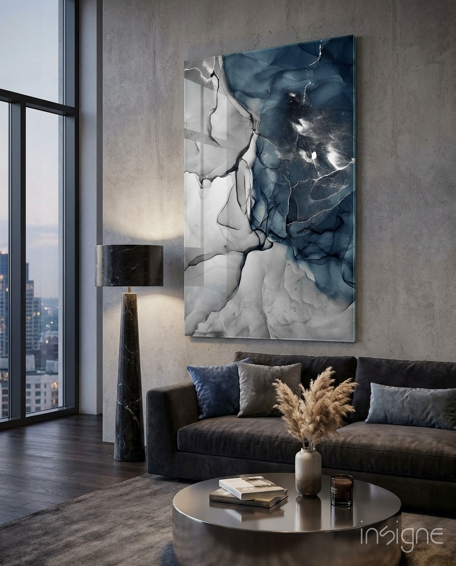 Navy Marble glass wall art displayed above a charcoal velvet sofa in an industrial concrete lounge