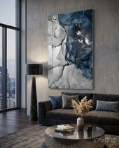 Navy Marble glass wall art displayed above a charcoal velvet sofa in an industrial concrete lounge