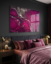 Fuchsia Smoke glass wall art displayed above an upholstered headboard in a charcoal-walled bedroom