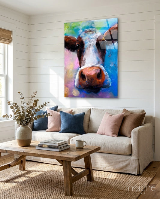 Painted Cow glass wall art displayed above a linen sofa in a shiplap-walled farmhouse living room