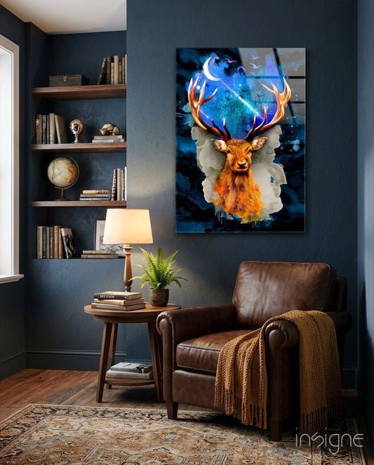 Cosmic Stag glass wall art displayed above a leather wing chair in a navy-walled library nook
