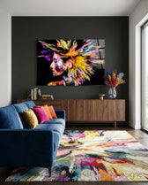 Colorful Thoughts glass wall art displayed above a walnut credenza in a charcoal-walled lounge
