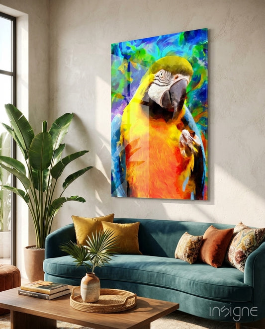 Macaw Bloom glass wall art displayed above a teal velvet sofa in a tropical beige living room