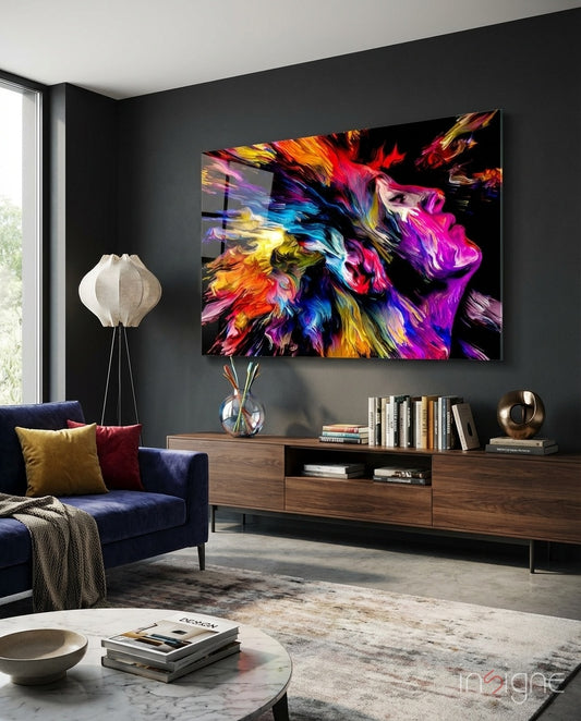 Ecstatic Mind glass wall art displayed above a navy sofa in a charcoal-walled lounge