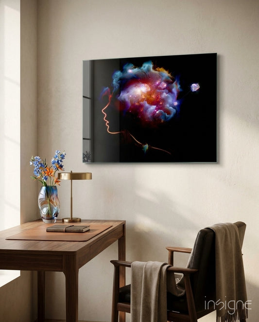 Cosmic Mind glass wall art displayed above a walnut writing desk in a warm minimalist study