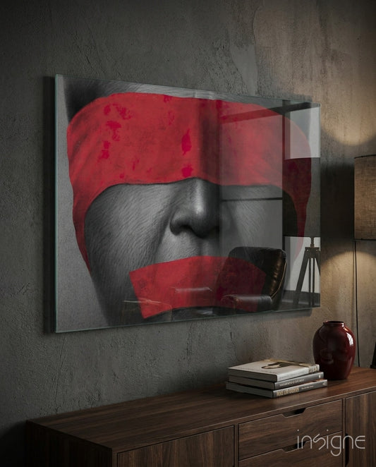 Silenced glass wall art displayed above a walnut credenza in a charcoal-walled lounge