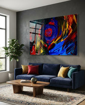 Cobalt Vortex glass wall art displayed above a navy velvet sofa in a charcoal-walled lounge