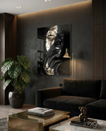 Gilded Gaze glass wall art displayed above a dark velvet sofa in a charcoal wood-paneled lounge