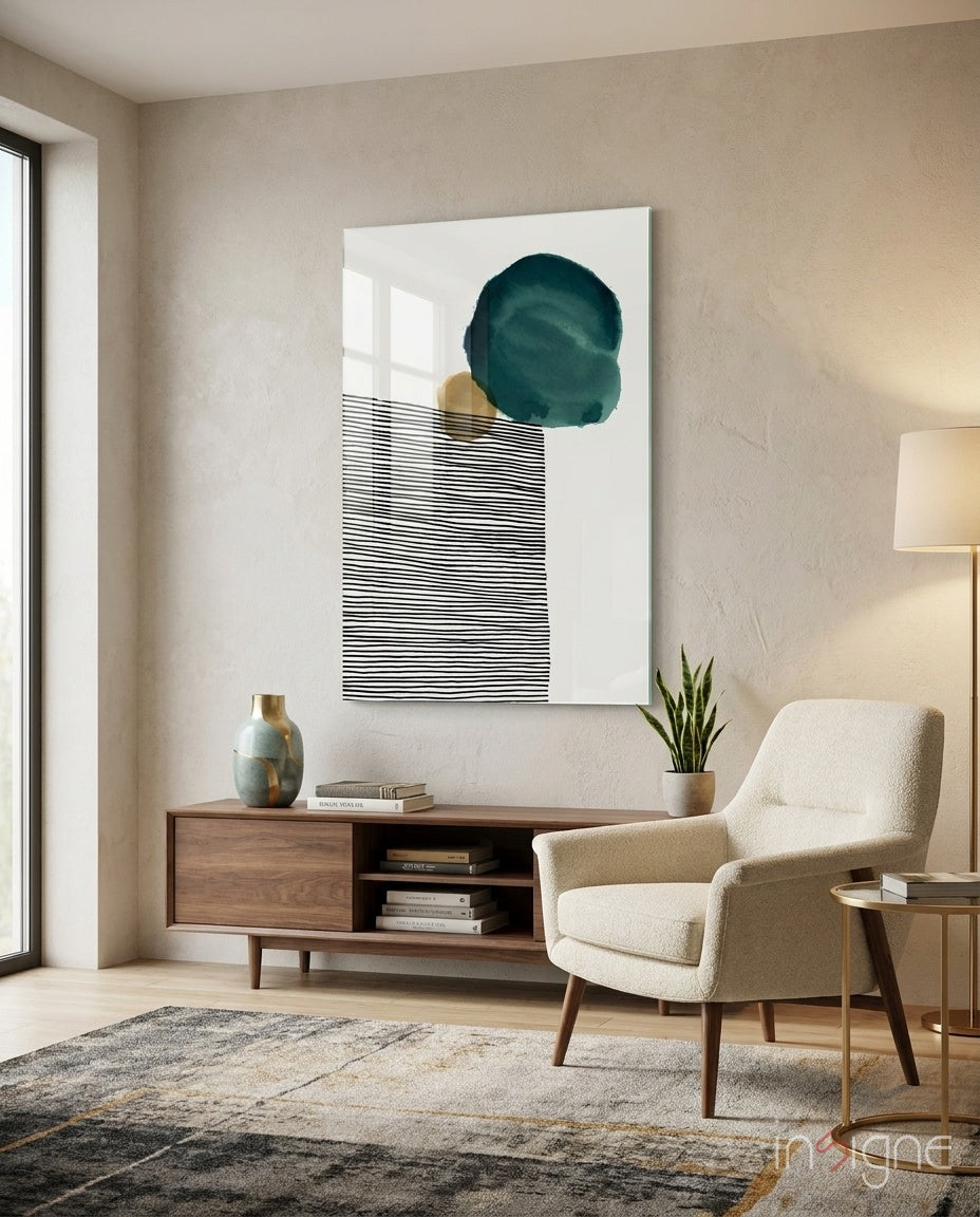 Lined Teal glass wall art displayed above a walnut credenza in a bouclé-armchair lounge