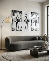 Ballet Triptych glass wall art displayed above a curved bouclé sofa in a warm minimalist living room