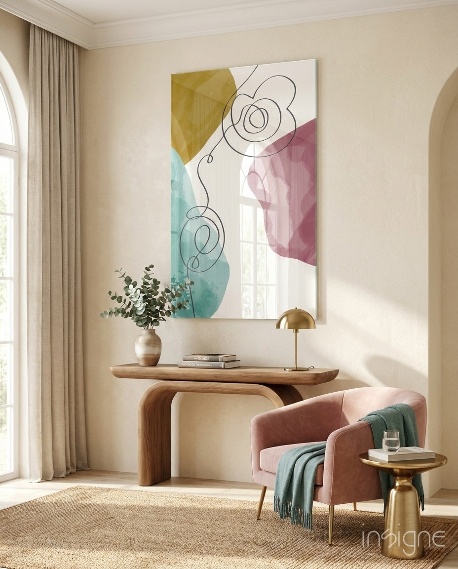 Pastel Drift glass wall art displayed above a wood console in a warm classical entryway with blush armchair