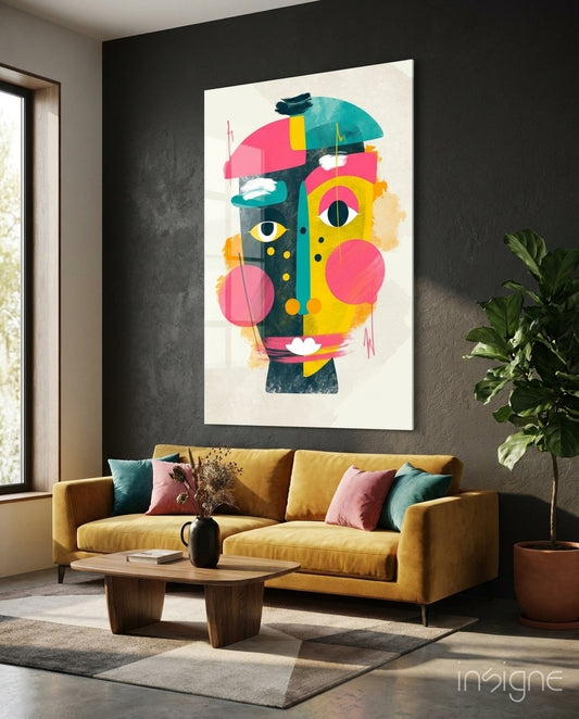 Pop Face glass wall art displayed above a mustard velvet sofa in a charcoal-walled lounge