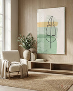 Line Tropical glass wall art displayed above a wood-shelf credenza in a wood-paneled living room