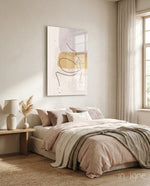 Mustard Line Portrait glass wall art displayed above a blush-linen bed in a warm beige bedroom