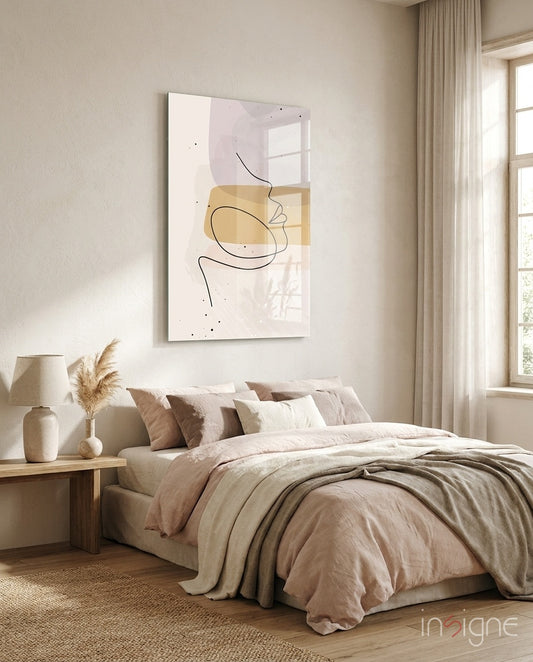 Mustard Line Portrait glass wall art displayed above a blush-linen bed in a warm beige bedroom