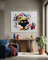 Street Mind glass wall art displayed above a wood console in a warm minimalist living room with navy chair