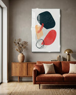 Wabi Crimson glass wall art displayed above a walnut credenza in a warm earth-toned lounge with rust velvet sofa