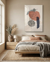 Leaf Branch glass wall art displayed above an upholstered headboard in a warm beige bedroom