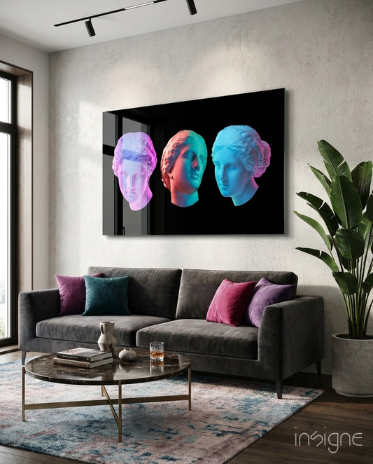 Vaporwave Trio glass wall art displayed above a charcoal velvet sofa in a contemporary lounge