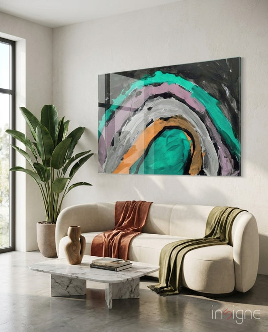Selmin Arcs glass wall art displayed above a curved bouclé sofa in a warm minimalist lounge
