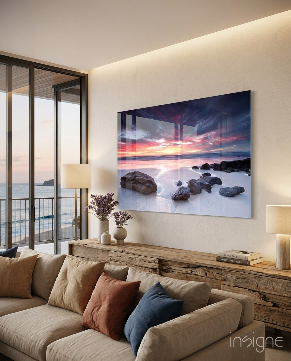 Beach Sunset glass wall art displayed above a wood low credenza in a bright modern coastal living room with linen sectional