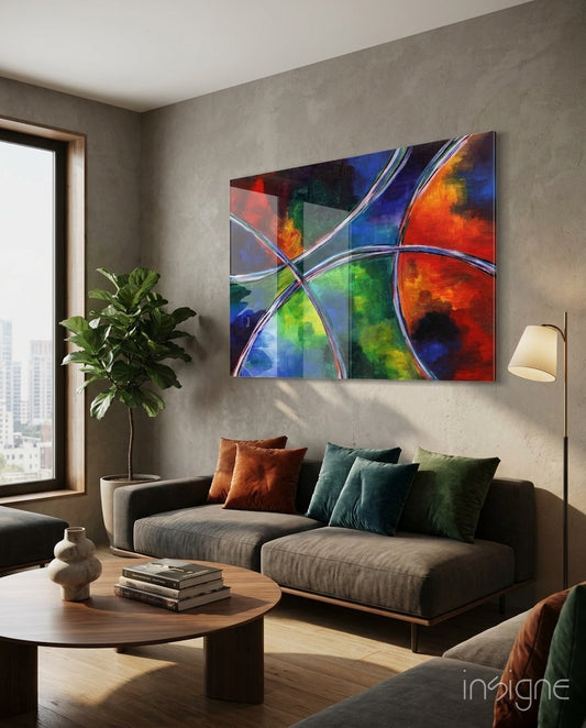 Color Circles glass wall art displayed above a charcoal sectional in a warm minimalist concrete-walled lounge
