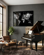 Music Map glass wall art displayed above a grand piano in a dark grey music-room lounge with cognac chair