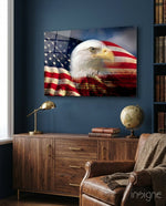 American Eagle glass wall art displayed above a walnut credenza in a navy-walled traditional study with brown leather chair