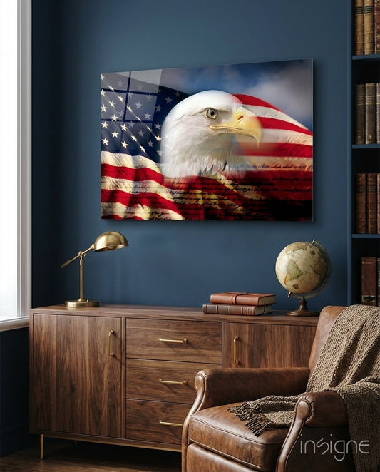 American Eagle glass wall art displayed above a walnut credenza in a navy-walled traditional study with brown leather chair