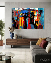 Festival Walk glass wall art displayed above a walnut credenza in a warm concrete-walled lounge with charcoal sofa