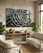 Silver Succulent glass wall art displayed above a wood console in a warm sandstone-walled lounge with bouclé chairs