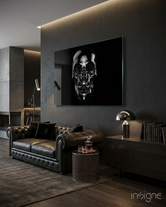 Black Skull glass wall art displayed above a brown chesterfield sofa in a dark wood-paneled lounge