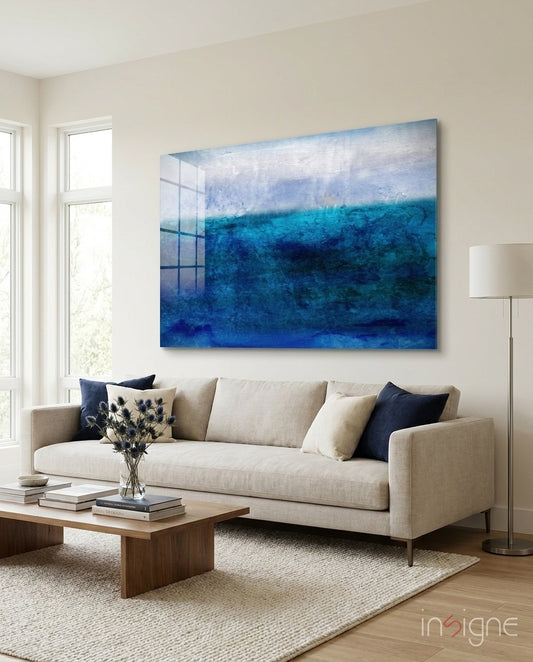 Indigo Sea glass wall art displayed above a linen sofa in a bright minimalist living room