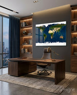Satellite Earth glass wall art displayed above a walnut desk in a dark wood-paneled office with city view
