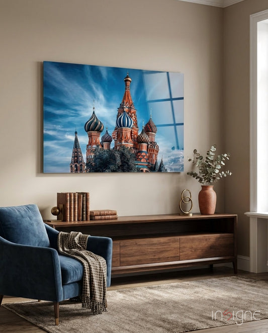 Moscow Cathedral glass wall art displayed above a walnut credenza in a warm beige lounge with navy velvet armchair
