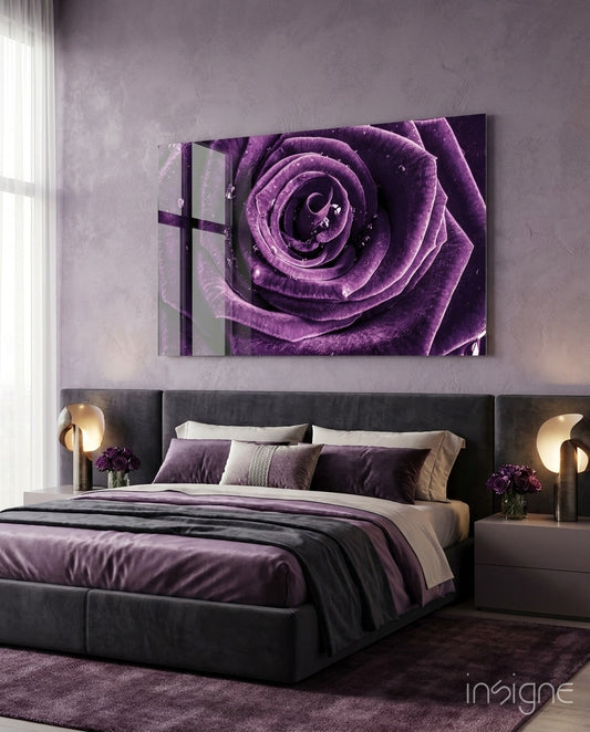 Purple Rose glass wall art displayed above an upholstered headboard in a lavender-walled bedroom with purple bedding