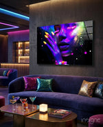 UV Glow glass wall art displayed above a navy velvet curved sofa in a luxe nightclub-style lounge with neon LED lighting