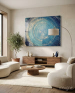Mosaic Rings glass wall art displayed above a walnut credenza in a warm minimalist living room with cream bouclé sofas